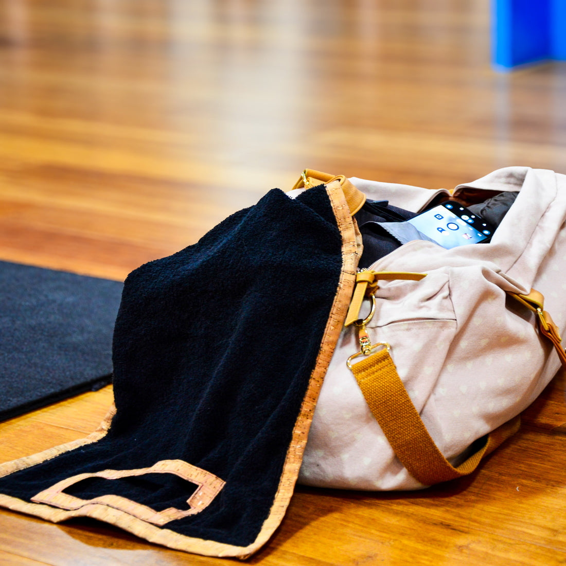 Media towel hanging from gym bag ready for workout.