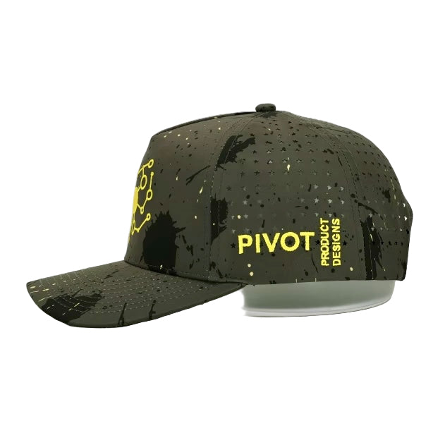 Left side view of camo Pivot Product Designs hat highlighting yellow logo stitching, star cutouts, and adjustable snapback.